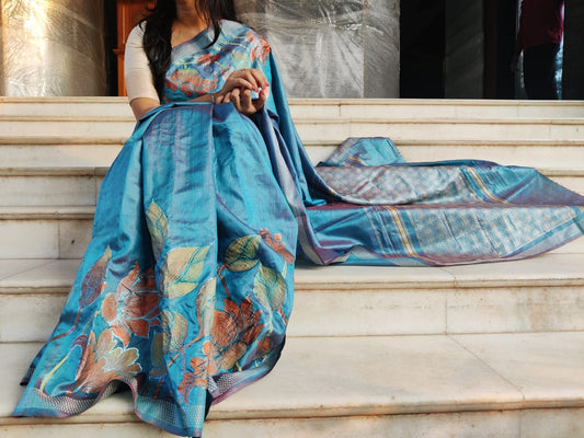 'Pushpa' handwoven and hand painted pure tassar metallic blue silk saree