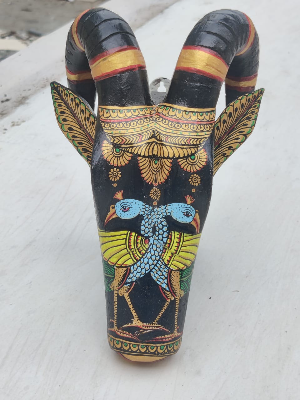 Hand painted Peacock Pattachitra on black Wooden Ram Head