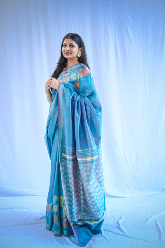 'Pushpa' handwoven and hand painted pure tassar metallic blue silk saree