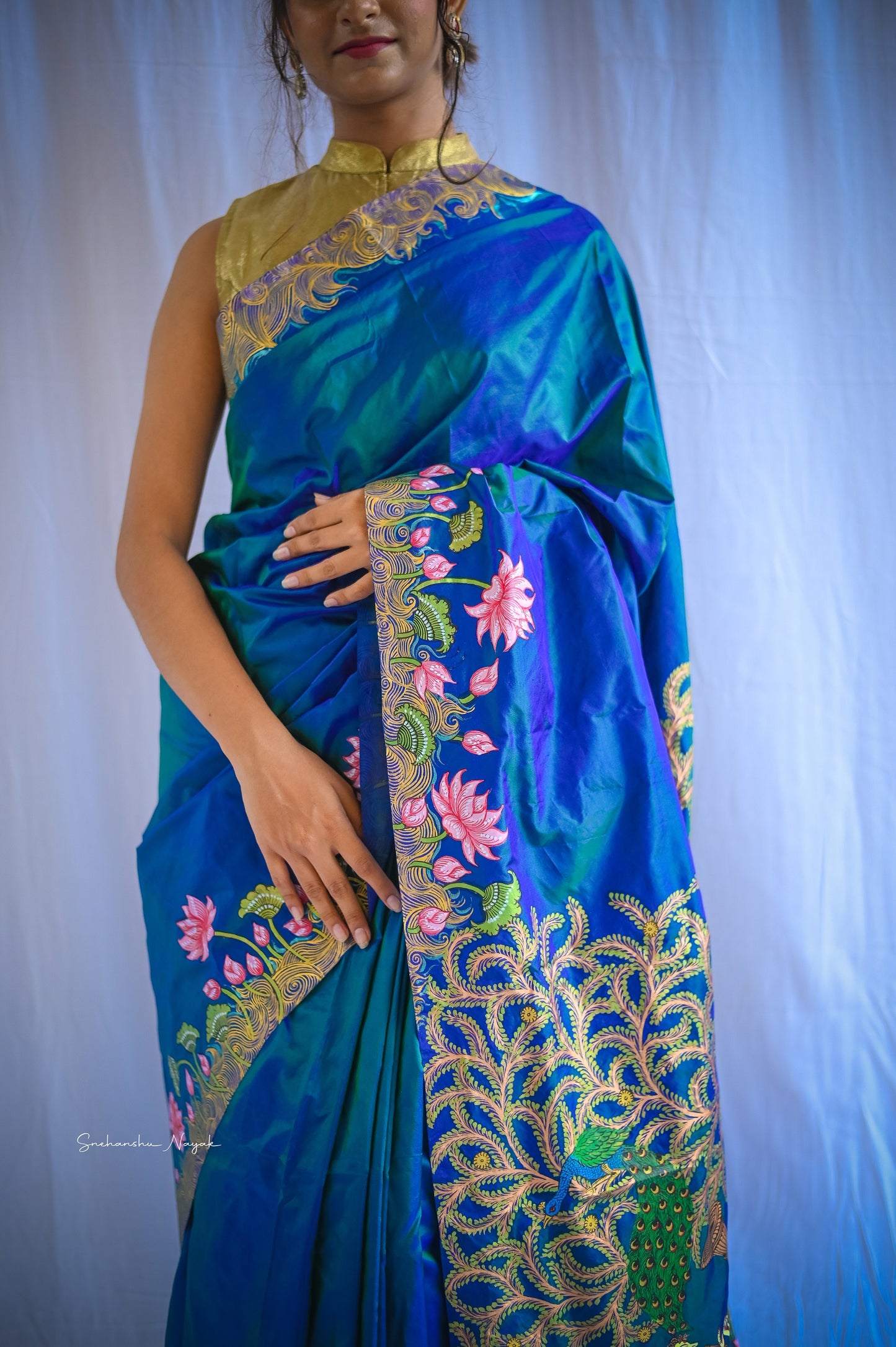 'Raas-Leela" lotus motifs handwoven and hand painted pure silk blue saree
